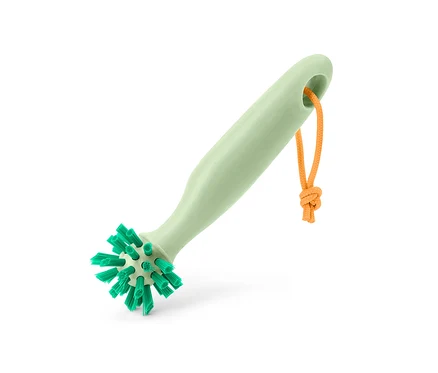 Eine grüne Universalreinigungsbürste mit einer orangefarbenen Schnur.
