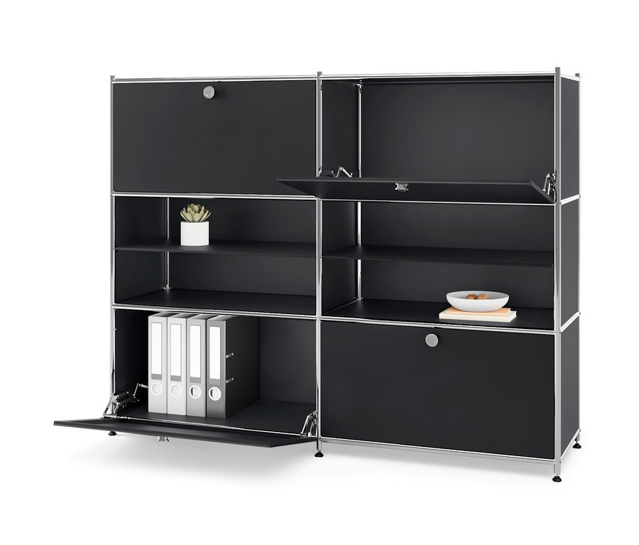 Schwarze Kommode Metall »CN3« mit vier Klappfächern, von denen einige offen sind und Ordner, eine Pflanze und eine Schale zeigen.