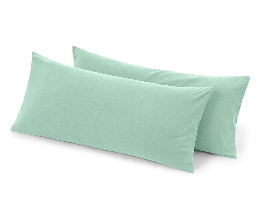 Zwei hellgrüne Körperkissen liegen übereinander.