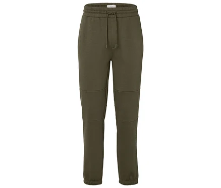 Grüne Jogginghose mit Kordelzug in der Taille.