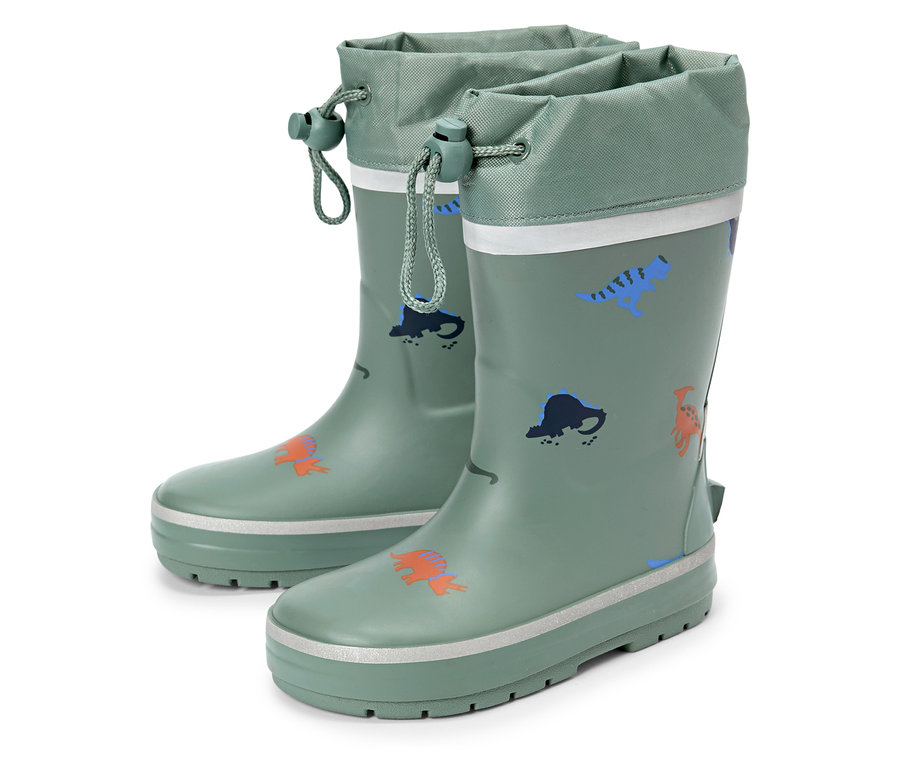 Paar grüne Gummistiefel mit Dinosaurier-Motiven und Kordelzug am Schaft.