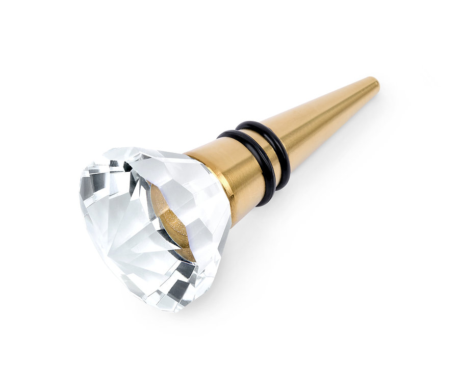 Goldener Flaschenkorken mit Kristallverzierung.