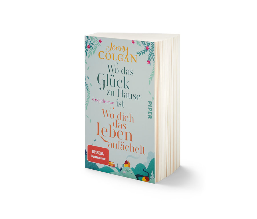 Das Buch Doppelroman »Wo das Glück zuhause ist« und »Wo dich das Leben anlächelt« von Jenny Colgan liegt auf dem Tisch.