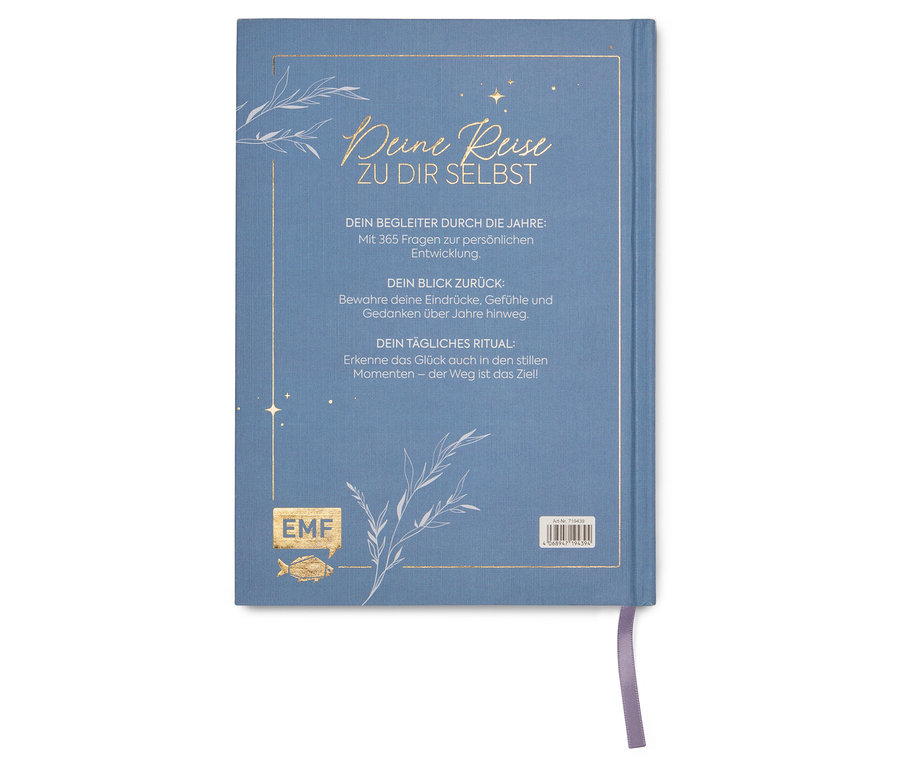 Blauer Kalender mit dem Titel "Deine Reise zu dir selbst" und silbernem Lesezeichen.