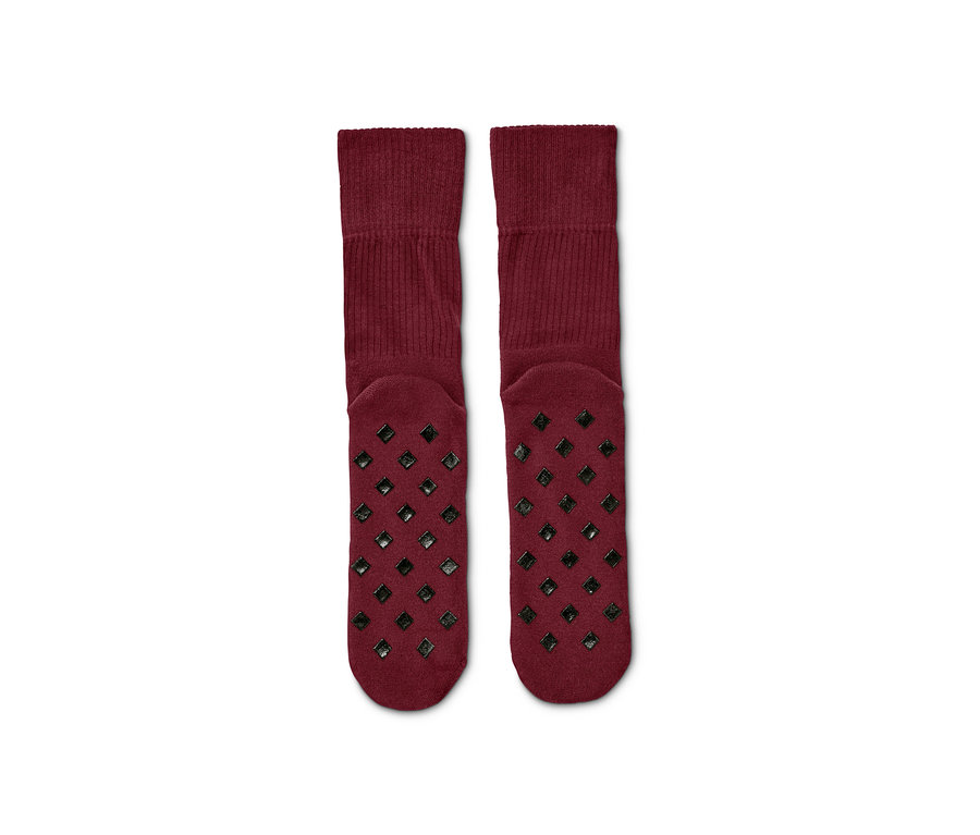 Zwei Paar bordeauxrote Stoppersocken.