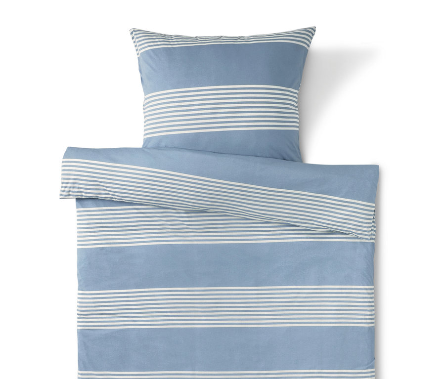 Blau-weiß gestreifte Bettwäsche mit Kissenbezug oben.
