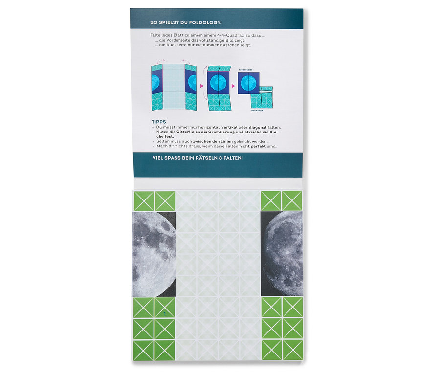 Anleitung und ein Buch »Origami-Rätsel« liegen auf einem Tisch.
