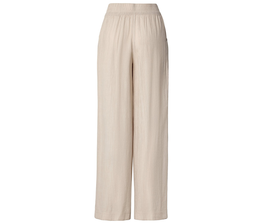 Beige, weit geschnittene Hose mit elastischem Bund.