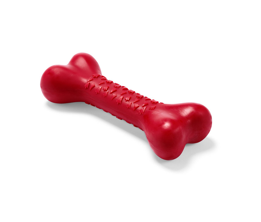 Ein rotes Hunde-Spielzeug in Knochenform.