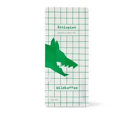 Weiße Packung Wildkaffee - Äthiopien West Arsi Omni-Roast mit grünem Gittermuster und Wolfskopf. 1 kg Ganze Bohne.