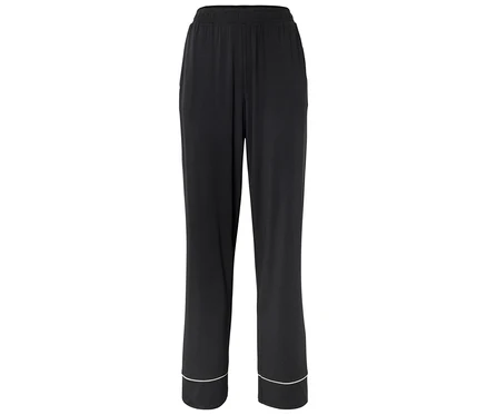 Schwarze weite Hose mit elastischem Bund und hellem Saum an den Beinabschlüssen.