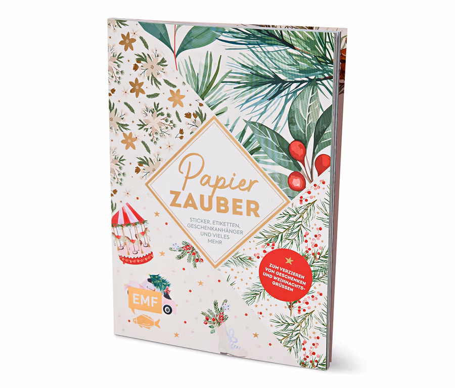 Buch mit Weihnachtsmotiv und dem Schriftzug Papier Zauber.