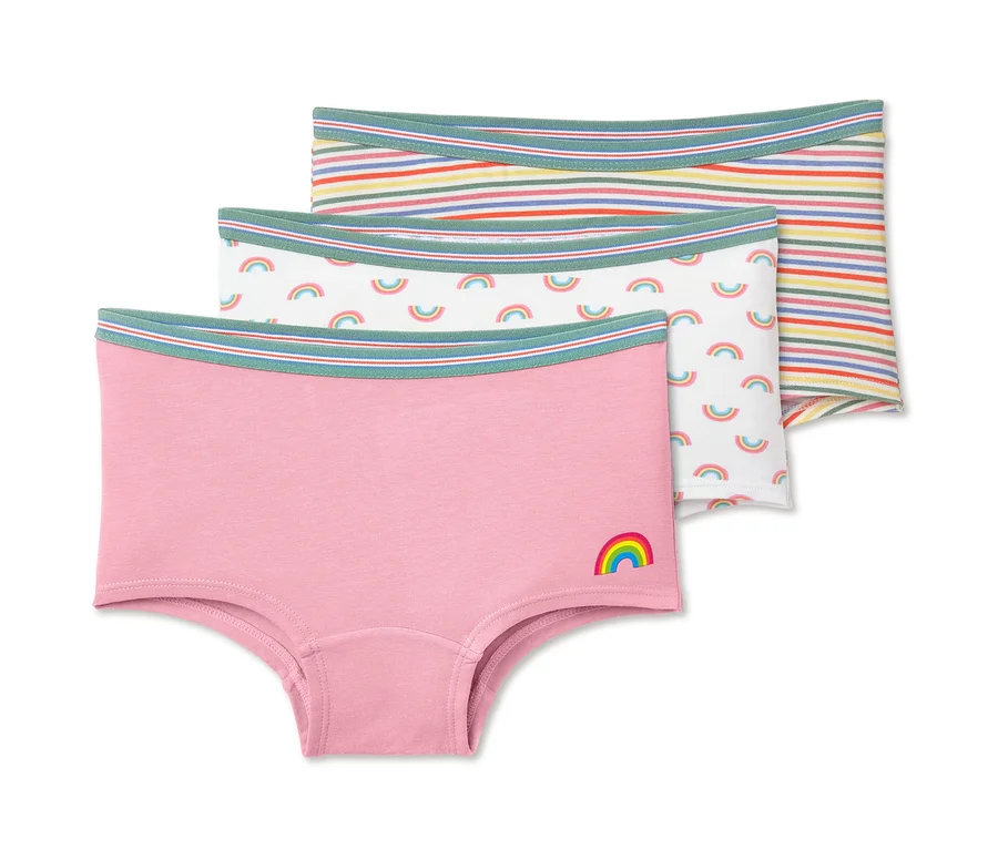 Drei Pantys: Eine rosafarbene mit Regenbogen, eine weiße mit Regenbogen und eine gestreifte.