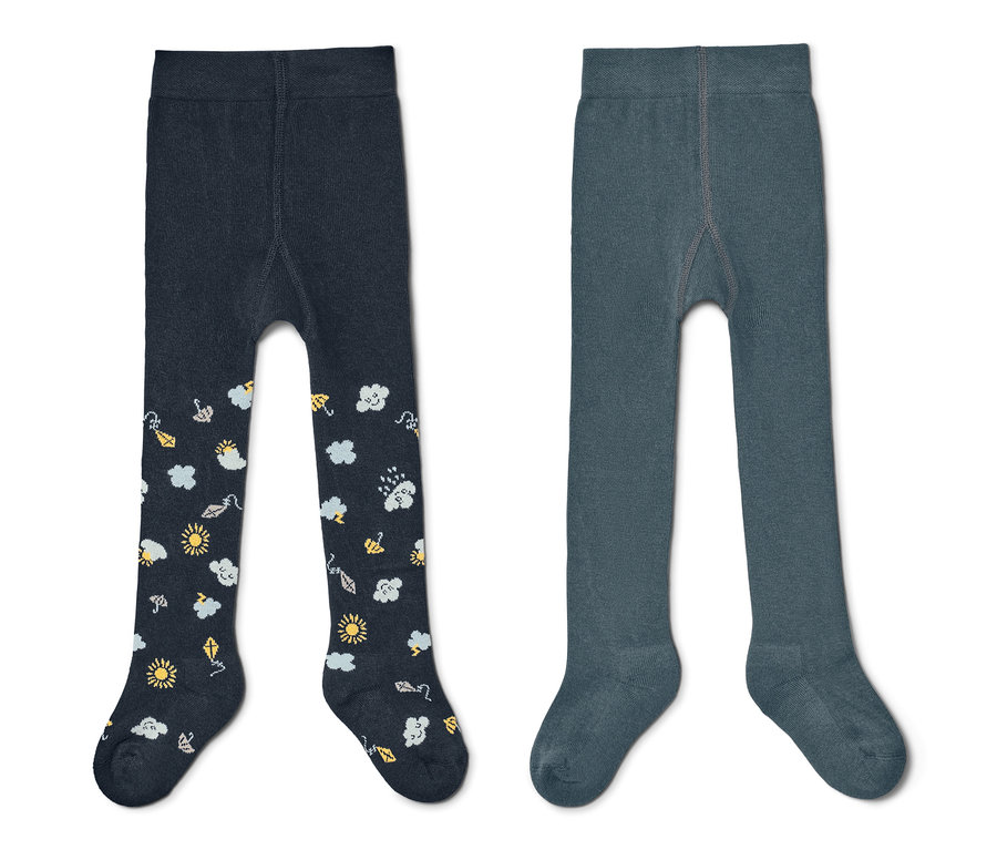 Zwei blaue Kleinkind-Strumpfhosen. Eine dunkelblaue mit Sonnen-, Wolken- und Regenmuster, eine hellblaue.