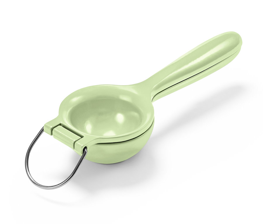 Eine grüne Zitruspresse.