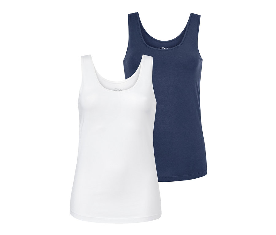 Zwei Hemdchen, eines blau und eines weiß.