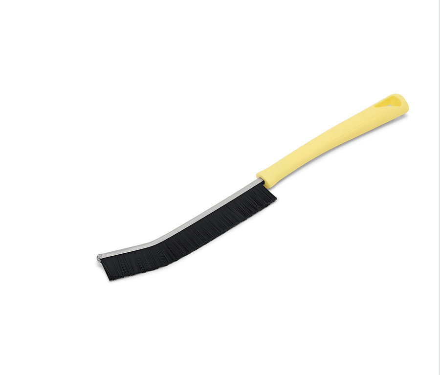 Gelbe Bürste mit schwarzen Borsten auf weißem Hintergrund.
