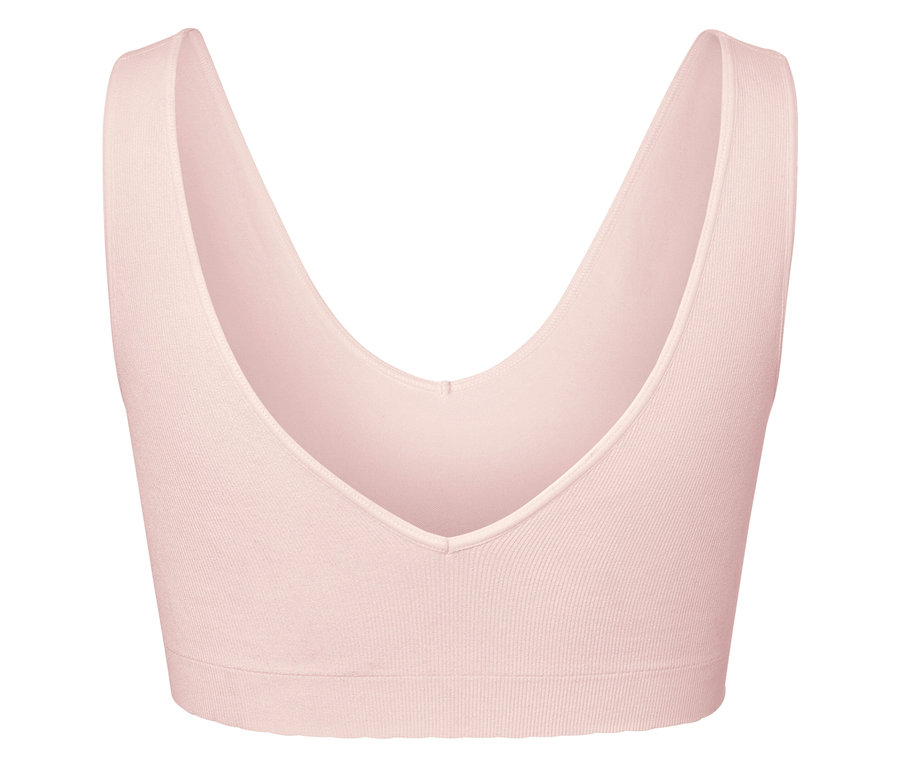 Detailaufnahme eines rosafarbenen Sport-BHs mit tiefem V-Ausschnitt.
