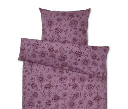 Lila Bettwäsche mit Blumenmuster.