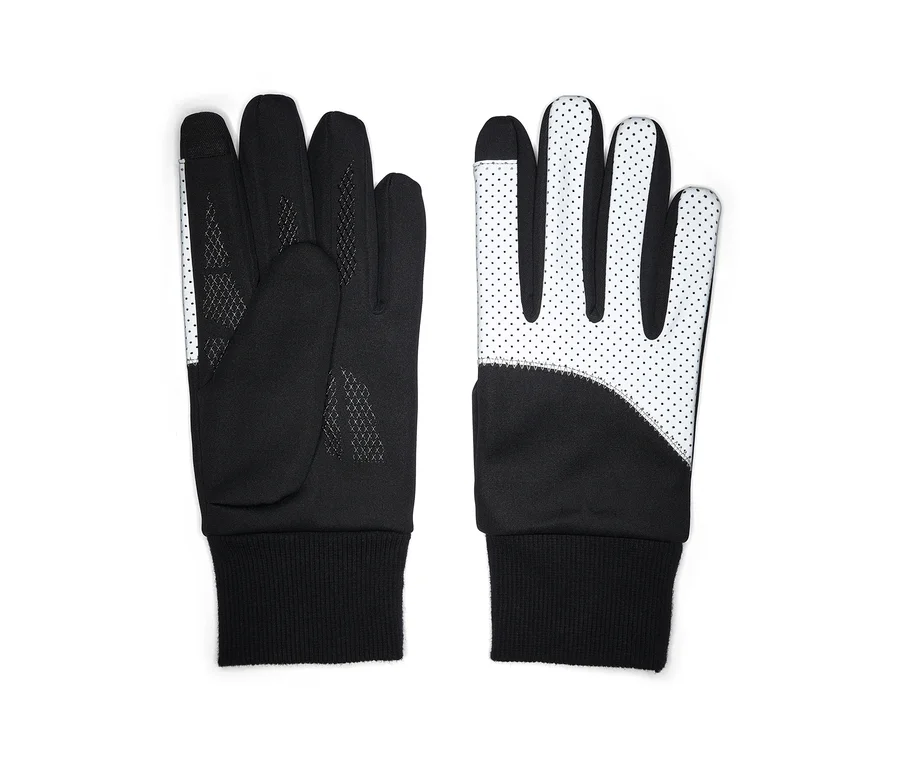 Ein Paar schwarz-weiße Handschuhe liegen flach. Der linke Handschuh zeigt die schwarze Handfläche mit einem strukturierten Muster und einem weißen gepunkteten Streifen an Daumen und Zeigefinger. Der rechte Handschuh zeigt den weißen Handrücken mit schwarzen Punkten und einem schwarzen Bereich am Handgelenk. Beide haben schwarze Rippenbündchen und touchscreen-kompatible Fingerspitzen.