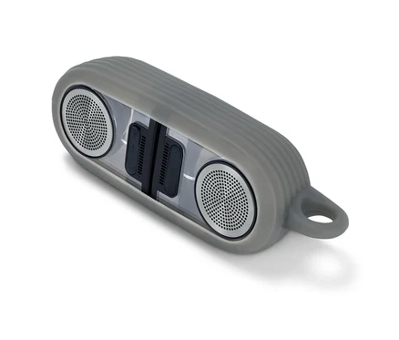 Grauer magnetischer TWS-Bluetooth®-Lautsprecher auf weißem Hintergrund.