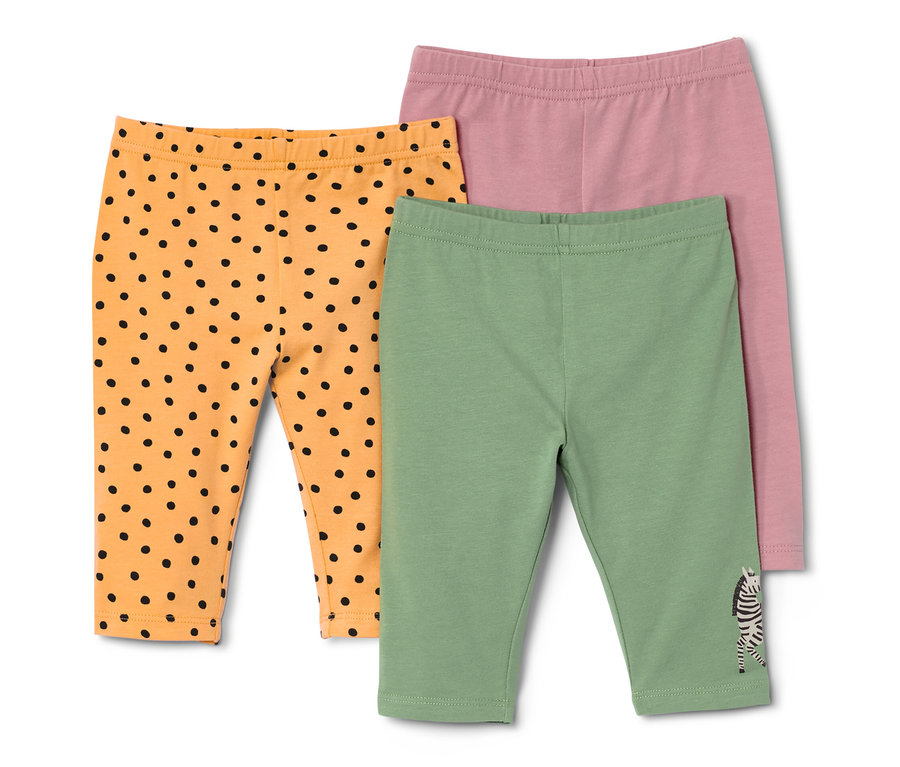 Drei Kinderleggings: orange mit schwarzen Punkten, grün mit Zebra und rosa.