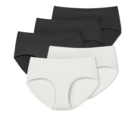 Fünf Magic-Cut-Pantys in Schwarz und Weiß sind in einer Reihe angeordnet.