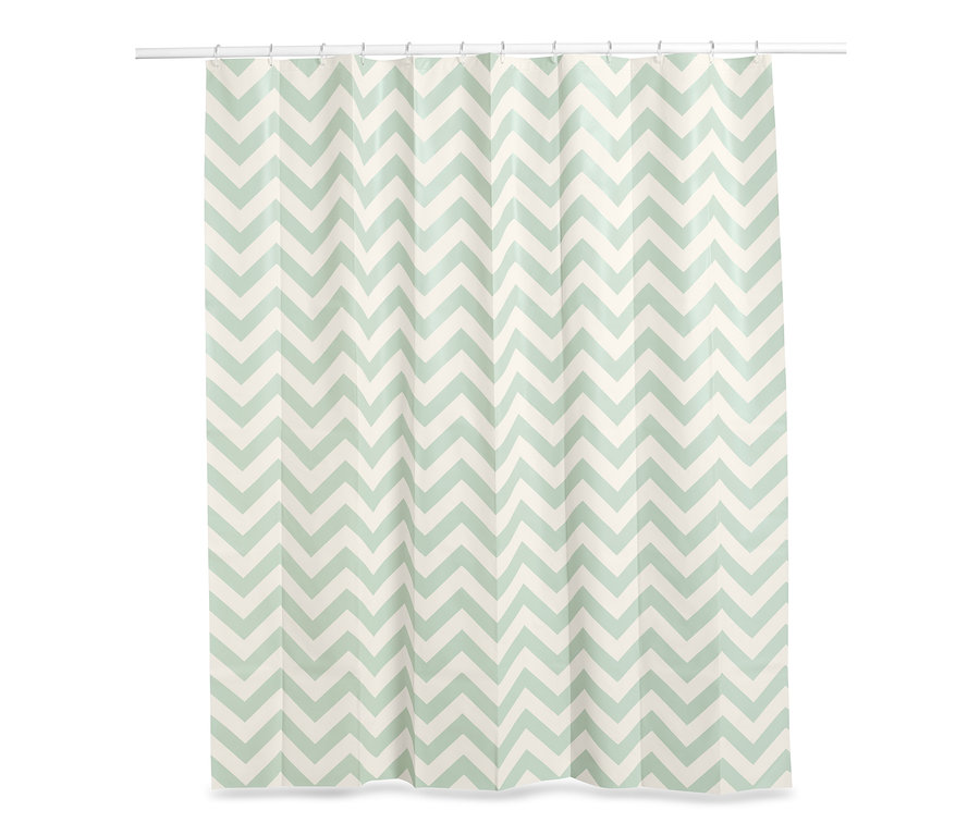 Ein Duschvorhang mit einem Zickzackmuster in Weiß und Grün.