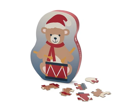 Puzzlebox mit Bär, der eine Trommel in Weihnachtsmannmütze spielt, und sechs Puzzleteilen.
