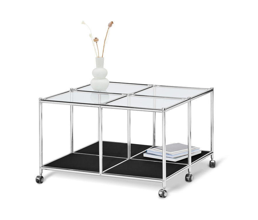 Schwarzer Couchtisch mit Rollen »CN3« mit Glasplatte, schwarzer Ablage und Vase mit Pflanzen.