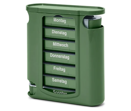 Ein grüner Pillen-Organizer mit Fächern für jeden Wochentag, beschriftet von Montag bis Sonntag.