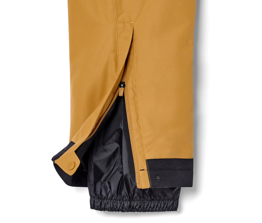Detailansicht einer Skihose in Camel mit geöffnetem Reißverschluss am Knöchel.
