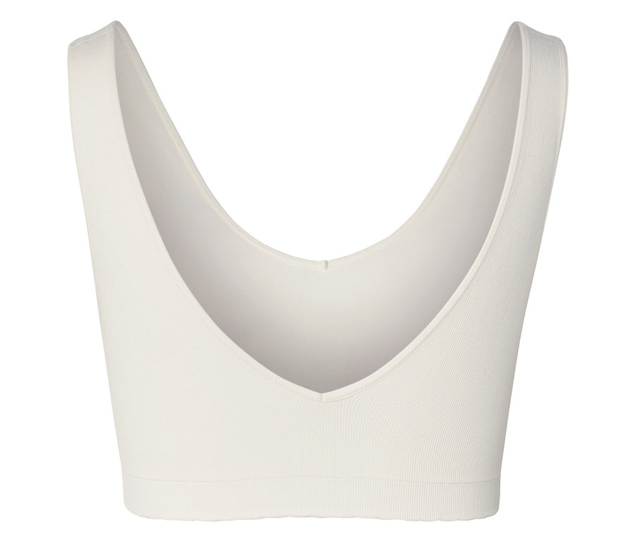 Nahaufnahme eines weißen Sport-BHs mit V-Ausschnitt.