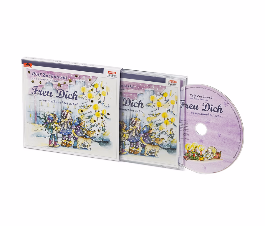 Cover und CD von Rolf Zuckowski »Freu dich! Es weihnachtet sehr ...« mit einer gezeichneten Illustration von Kindern und einem Hund an einem Weihnachtsbaum.
