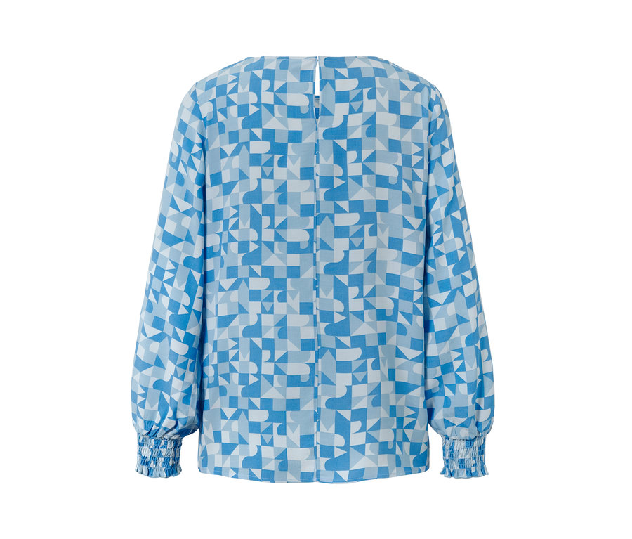 Eine blau-weiss bedruckte Bluse mit geometrischem Muster.