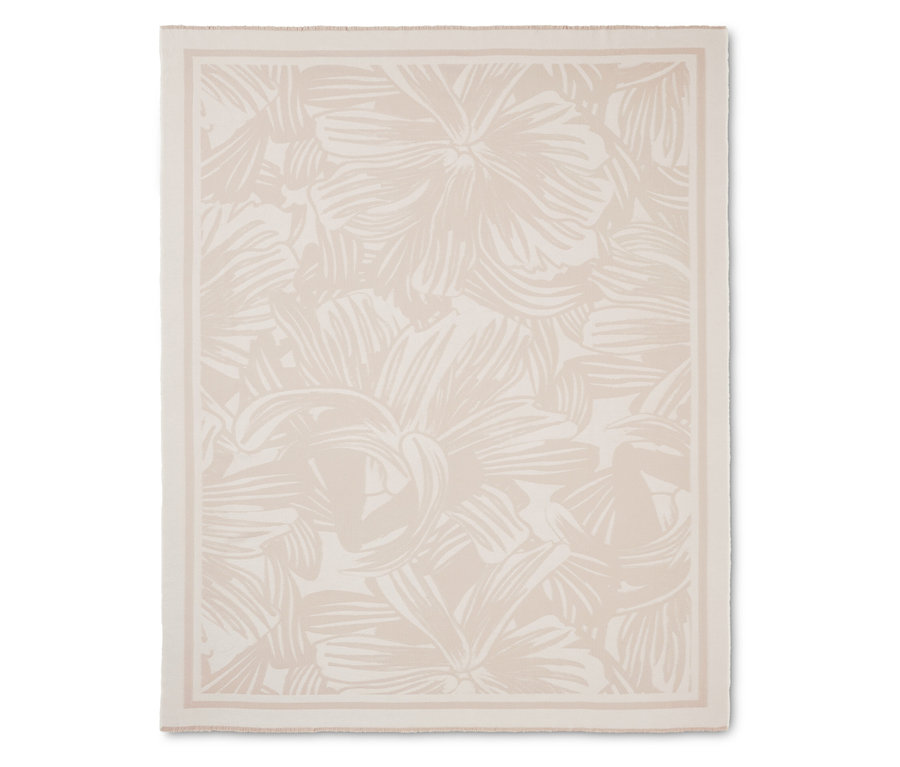 Cremefarbene Decke mit Blumenmuster und Bordüre.