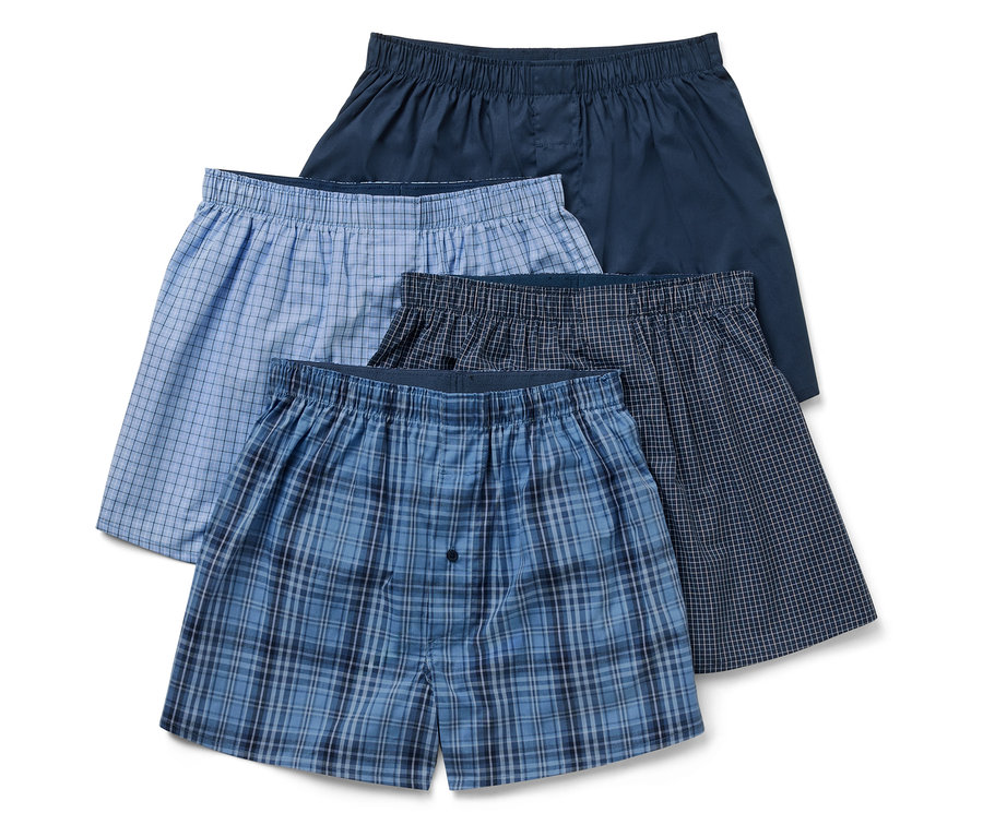 Vier Herren Boxershorts in verschiedenen Farben und Mustern.