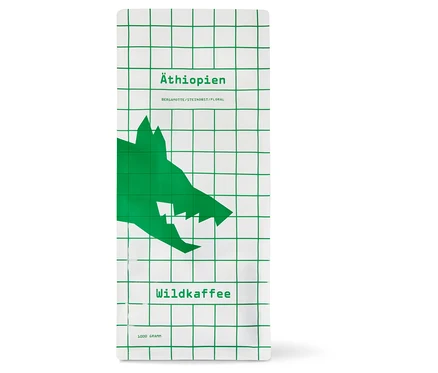 Weiße Packung Wildkaffee - Äthiopien West Arsi Omni-Roast mit grünem Gittermuster und Wolfskopf. 1 kg Ganze Bohne.