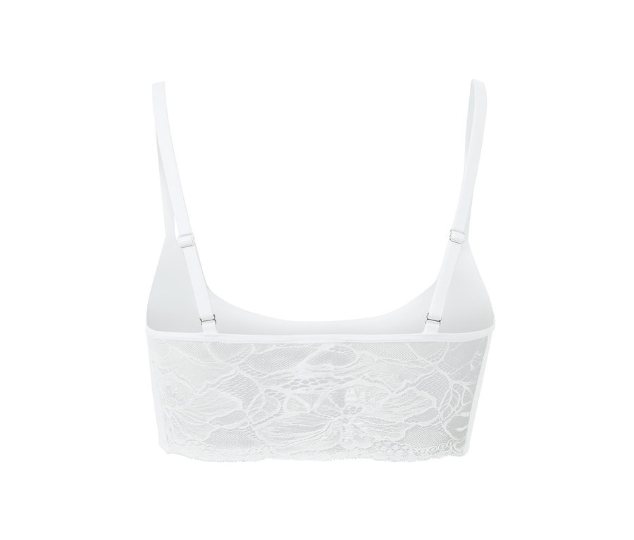 Detailaufnahme eines weißen Seamless-Bustiers mit Spitze.