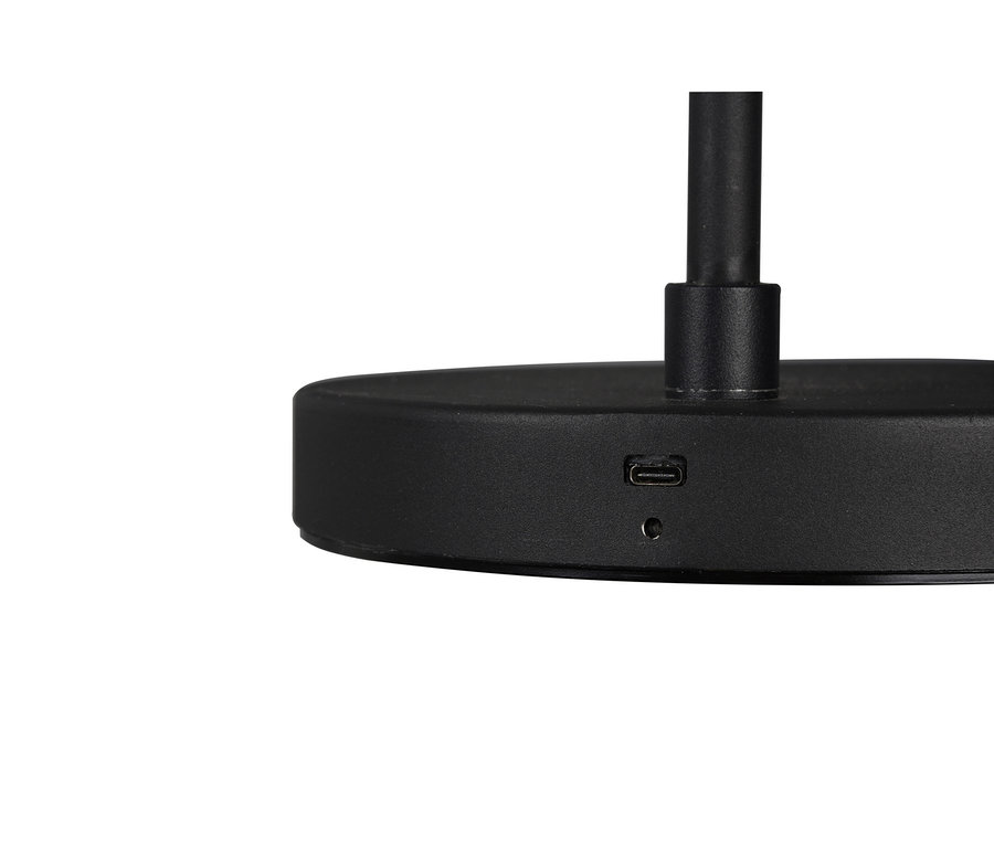 Nahaufnahme des mattschwarzen Lampenfußes mit einem USB-C-Anschluss und einer kleinen runden Anzeigeleuchte.