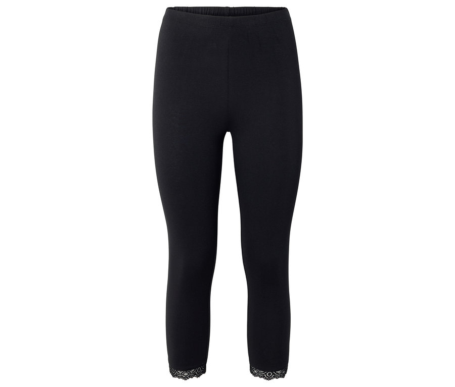 Schwarze Leggings mit Spitzenbesatz am Saum.
