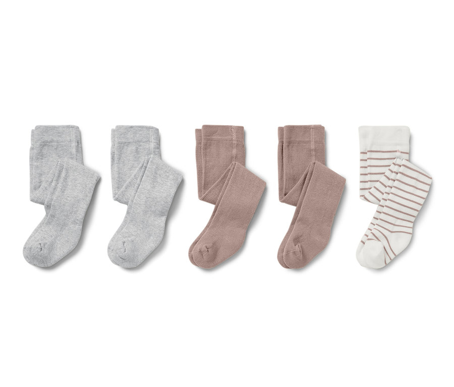 Drei Paar Baby-Strumpfhosen in Grau, Braun und gestreift.