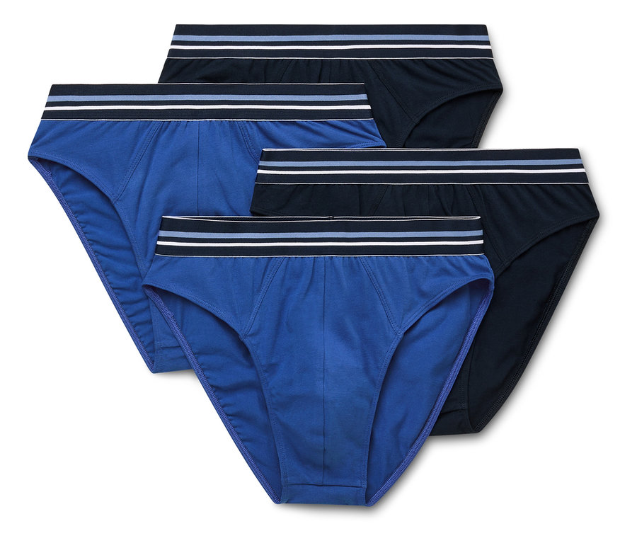 Vier Herrenslips in Blau und Schwarz liegen übereinander.