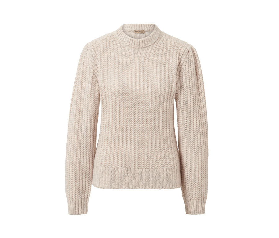 Ein cremefarbener Grobstrick-Pullover mit Wolle.