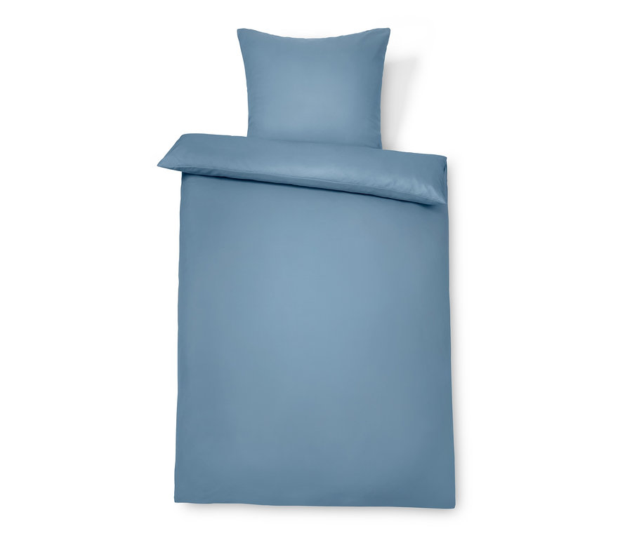 Blaue Microfaser-Bettwäsche Normalgröße auf einem Bett.