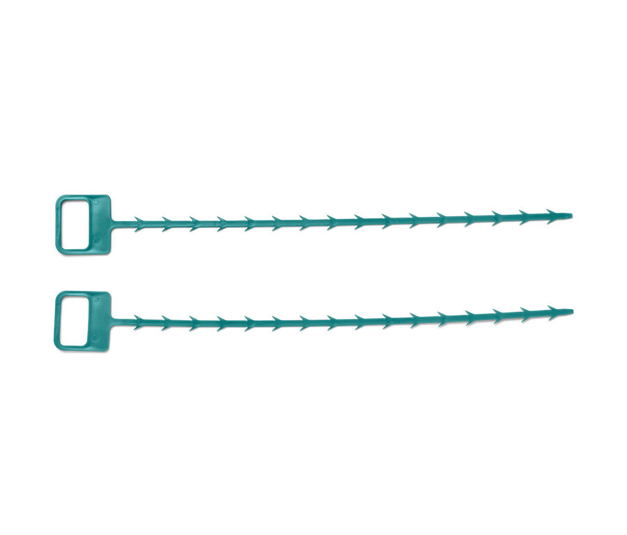 Zwei grüne Abflussreiniger liegen nebeneinander.