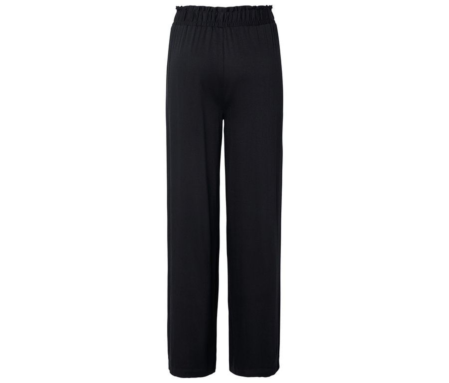Schwarze, locker sitzende Hose mit elastischem Bund, von hinten fotografiert.