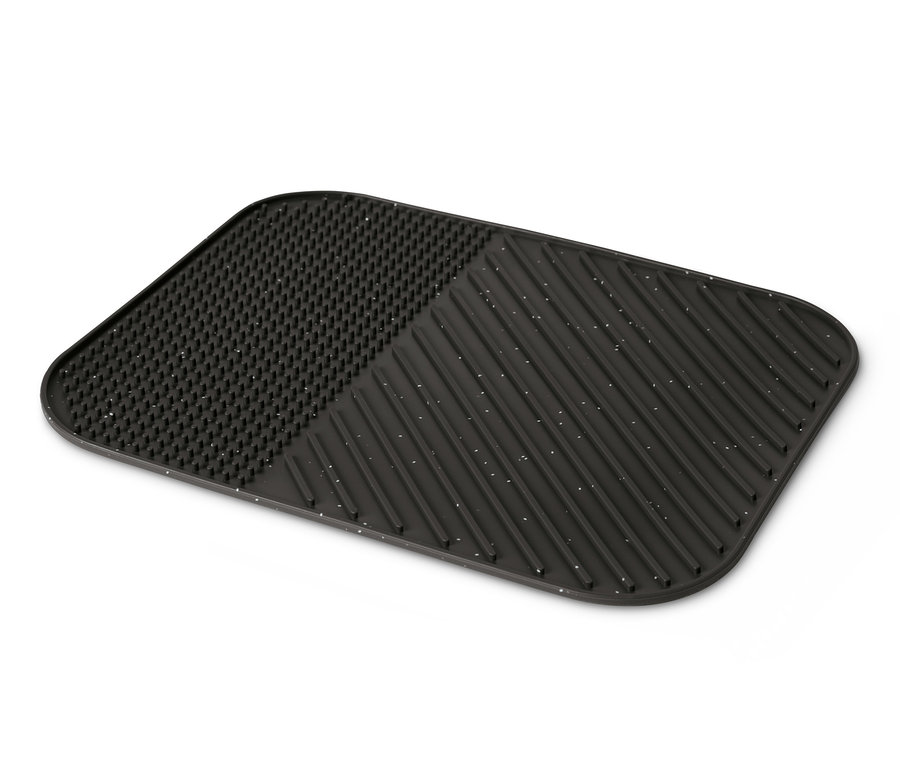 Eine schwarze Silikon-Abtropfmatte mit Sprenkeln und unterschiedlichen Oberflächen.
