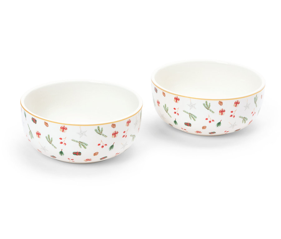 Zwei Schalen mit weihnachtlichem Muster stehen auf einem weißen Hintergrund.