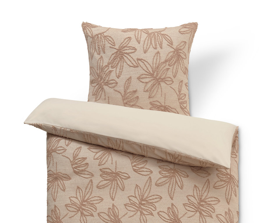 Bettwäsche mit getufteter Verzierung.